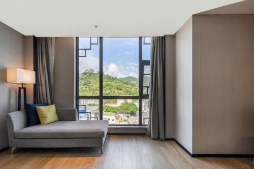 Postel nebo postele na pokoji v ubytování Echarm Hotel Baise Xilin