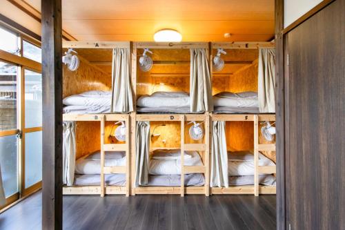 Ένα ή περισσότερα κρεβάτια σε δωμάτιο στο Haguruma芦屋