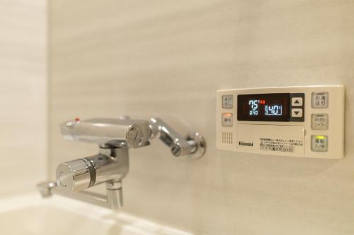 Ένα μπάνιο στο 難波民泊