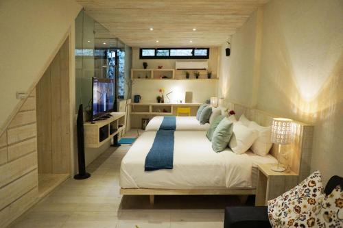 Ένα δωμάτιο στο 湛藍海岸民宿 Azure--這個夏天有點藍--墾丁南灣沙灘-可包棟-國旅卡特約店