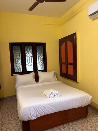 Postel nebo postele na pokoji v ubytování Ram Sethu Home Stay