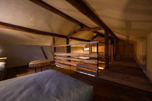 a bedroom with a bed and a wooden wall at cofunia in Tenri