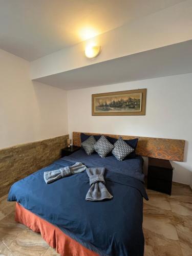 Postel nebo postele na pokoji v ubytování Centrum Apartman