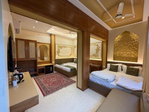 a bedroom with a bed and a sink in a room at Hotel Temple On Ganges in Varanasi