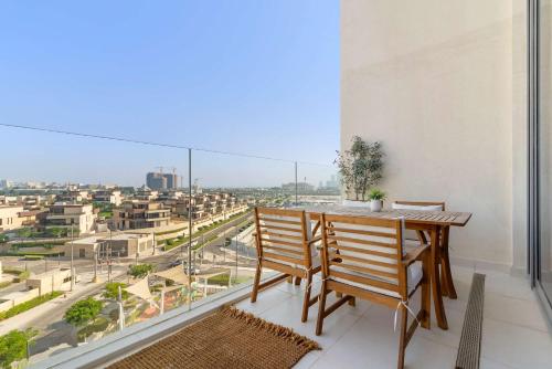 a dining room with a view of a city at Silkhaus Vacation Homes Sea View 1BR in Mamsha Al Saadiyat at Azure in Abu Dhabi
