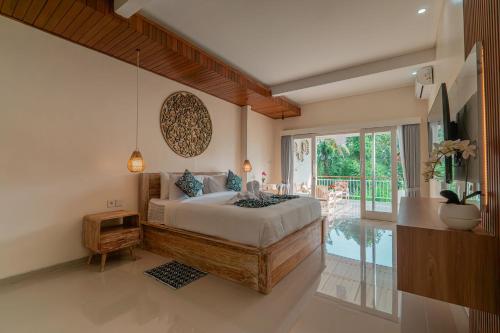 Ένα ή περισσότερα κρεβάτια σε δωμάτιο στο Inda Villa Ubud by Bali Cabin