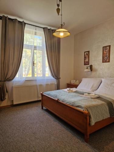 Postel nebo postele na pokoji v ubytování Apartmány Aurelius