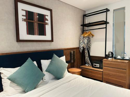 Ένα ή περισσότερα κρεβάτια σε δωμάτιο στο Tes Haus Phu Yen