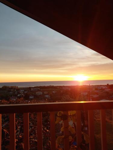 a view of the sunset from the balcony of a condo at Sol Apartments Gjiri Lalzit in Durrës