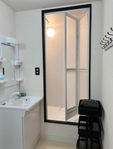 a bathroom with a mirror and a sink at Foresta Karuizawa 6 "Glamping & Tent" for 8 people in Karuizawa
