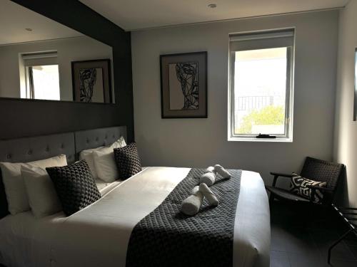 Postel nebo postele na pokoji v ubytování Spice On Broadway