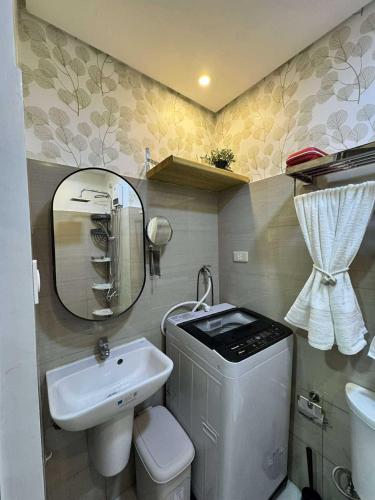 a small bathroom with a toilet and a sink at Blisshaven SHORE 2 B03-14100 in Sampong