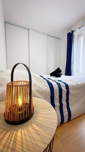 a bedroom with a bed and a table with a table at L'Atelier des Arts in La Rochelle