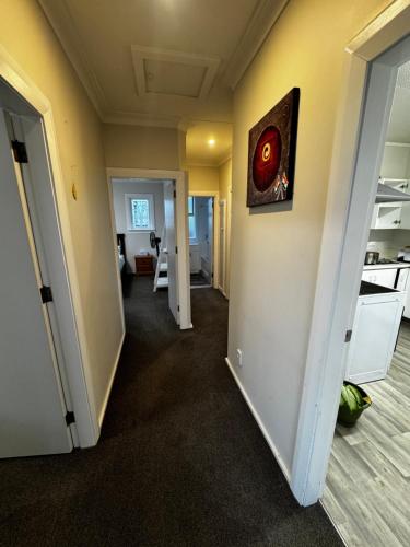 a hallway of a house with a room at Relax In Mosgiel in Mosgiel