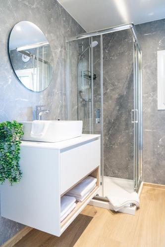 a bathroom with a sink and a shower at Ferienhaus Landliebe Lodges in Falkenthal