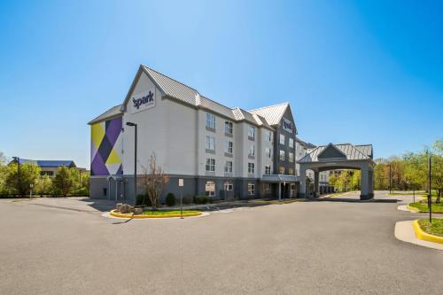 a rendering of a hotel with a parking lot at Spark by Hilton in Woodbridge