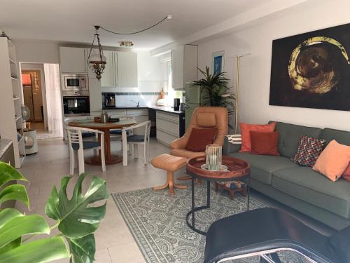 a living room with a couch and a table at Ferienwohnung Buntspecht in Bad Wildbad