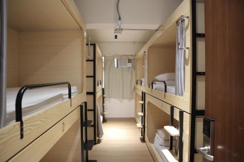 Postel nebo postele na pokoji v ubytování The House (Baguio)