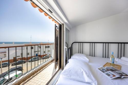 Postel nebo postele na pokoji v ubytování Estúdio Praia da Luz