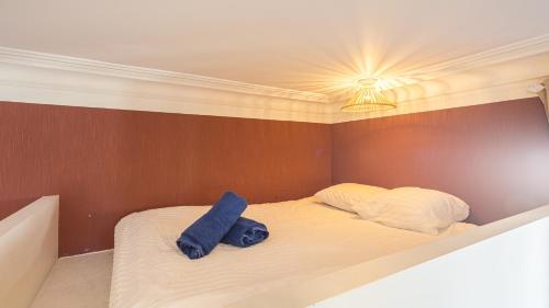 Postel nebo postele na pokoji v ubytování BonAppart 14 - Charme Napoléonien & Confort