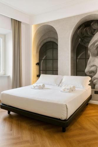 Ένα ή περισσότερα κρεβάτια σε δωμάτιο στο Hotel Villa Flavia