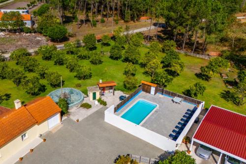 an aerial view of a house with a swimming pool at Casa do Sobreiro in Cantanhede