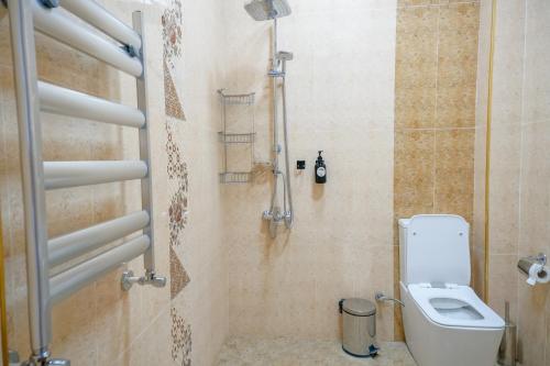 a bathroom with a toilet and a shower at Qusar Boutique in Qusar