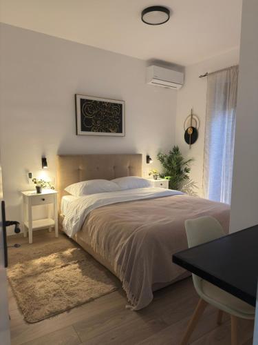 Ένα ή περισσότερα κρεβάτια σε δωμάτιο στο Julies Homes