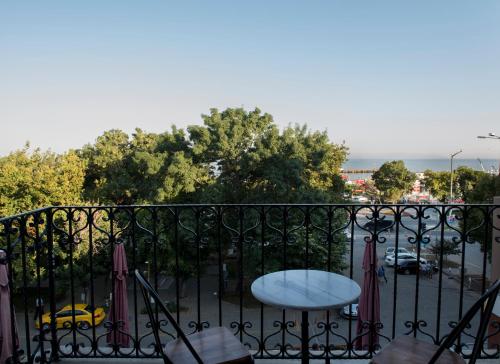 a balcony with a table and a view of a parking lot at Rodosto Hotel in Tekirdag