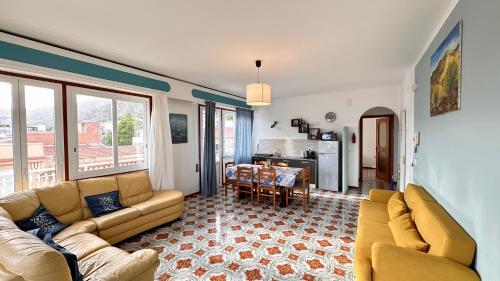 a living room with a couch and a table at Mondello SunSea House in Mondello