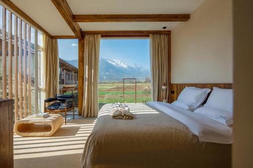 Ένα ή περισσότερα κρεβάτια σε δωμάτιο στο Lijiang Tennessee Farmhouse hotel