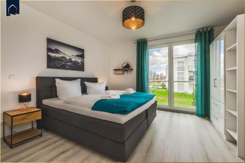 Postel nebo postele na pokoji v ubytování An der Haffküste Meerzeit