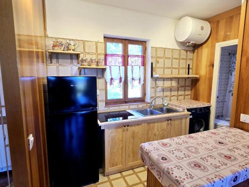 Kuchyň nebo kuchyňský kout v ubytování Casa Malva - Residenze Bucaneve