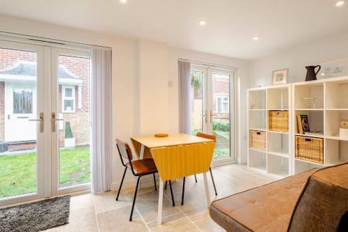 a dining room with a table and chairs at Skylight Studio near Hospital in Kings Lynn