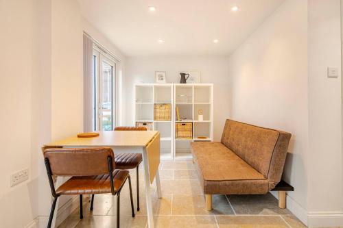 a dining room with a table and a chair at Skylight Studio near Hospital in Kings Lynn