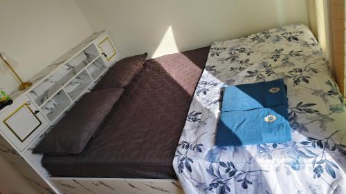 Postel nebo postele na pokoji v ubytování ทุ่งเศรษฐีโฮมสเตย์แอนด์คาเฟ่