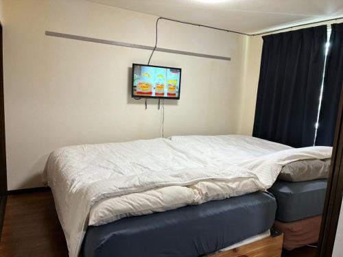 Ένα ή περισσότερα κρεβάτια σε δωμάτιο στο Sunny Heights Oyama - Vacation STAY 19827