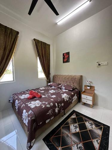 Postel nebo postele na pokoji v ubytování Zarul Homestay