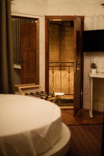 a view of a room with a door and a balcony at Hotel Estara in Urfa