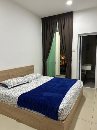 Ένα ή περισσότερα κρεβάτια σε δωμάτιο στο Ella Residence Roomstay