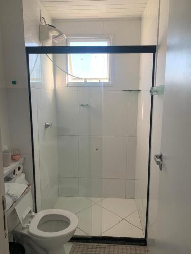 a bathroom with a shower and a toilet at Aconchego da day in Aracaju