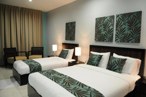 Giường trong phòng chung tại Marina Oriental Hotel