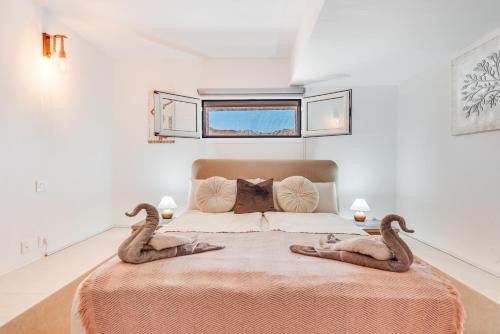 En eller flere senge i et værelse på Moser Living Premium Apartments - Puerto Rico