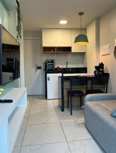 Kuchyň nebo kuchyňský kout v ubytování Flat com piscina privativa