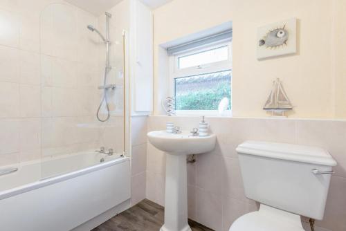 a bathroom with a toilet and a sink and a shower at 2 Bed in Haverigg oc-s33747 in Haverigg