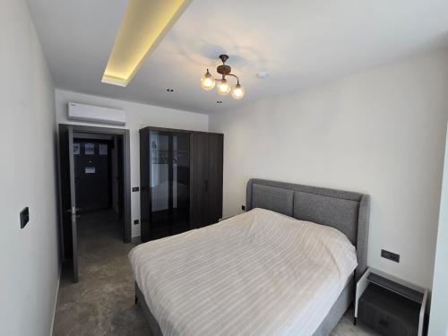 a bedroom with a bed and a ceiling at 'Ultra Luxury Holiday Apt in the Heart of the City in Alanya