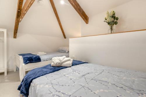 a bedroom with two twin beds with blue sheets at 2 Bed in Newchapel oc-c33691 in Newchapel