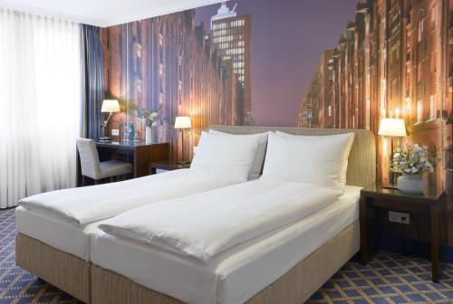 Postel nebo postele na pokoji v ubytování Hotel Stella Maris