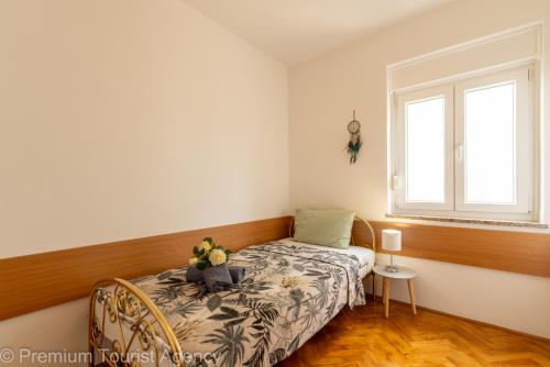 Postel nebo postele na pokoji v ubytování Miljenko