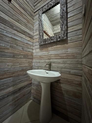 a bathroom with a sink and a mirror at Danys House at Tiki Bar and More in Nusa Lembongan